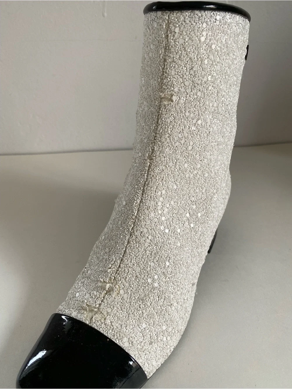 CHANEL White Sequin Ankle Boots with Black Cap Toe. Runway astronaut collection.